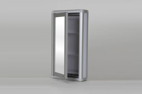 Mirrored bathroom cabinet with handles.