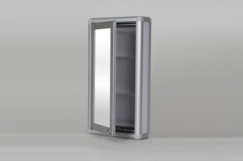 Mirrored bathroom cabinet with handles.