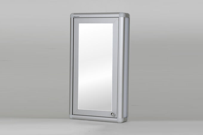 Mirrored bathroom cabinet with handles.