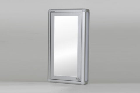Mirrored bathroom cabinet with handles.