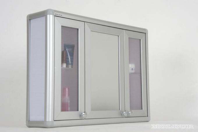Mirrored bathroom cabinet, three doors, above the sink.